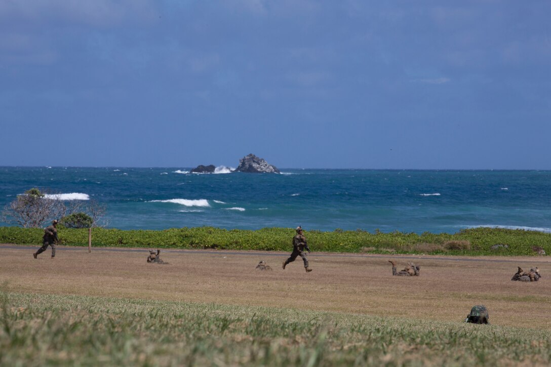 Philippine marines and U.S. Marines with Company A, 1st Battalion, 3rd Marine Regiment, post security around a CH-53E Super Stallion helicopter during an air-assault rehearsal as part of Rim of the Pacific (RIMPAC) exercise on Marine Corps Base Hawaii July 6, 2018. RIMPAC provides high-value training for task-organized, highly-capable Marine Air-Ground Task Force and enhances the critical crisis response capability of U.S. Marines in the Pacific. Twenty-five nations, 46 ships, five submarines, about 200 aircraft and 25,000 personnel are participating in RIMPAC from June 27 to Aug. 2 in and around the Hawaiian Islands and Southern California.