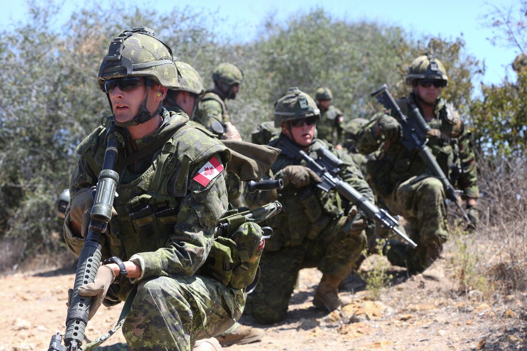 Canadian soldiers with the Royal 22e Régiment plan a squad-level attack at a live-fire range during Rim of the Pacific (RIMPAC) exercise at Marine Corps Base Camp Pendleton, California, July 6, 2018. The training provided a dynamic environment, challenging leaders at the fire team and squad level by requiring the soldiers to react to pop-up targets in a tactical setting. RIMPAC provides high-value training for task-organized, highly-capable Marine Air-Ground Task Force and enhances the critical crisis response capability of U.S. Marines in the Pacific. Twenty-five nations, 46 ships, five submarines, about 200 aircraft and 25,000 personnel are participating in RIMPAC from June 27 to Aug. 2 in and around the Hawaiian Islands and Southern California.