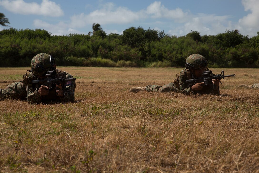 Malaysian soldiers provide security during assault amphibious vehicle familiarization training as part of Rim of the Pacific (RIMPAC) exercise on Marine Corps Base Hawaii July 5, 2018. RIMPAC provides high-value training for task-organized, highly-capable MAGTF and enhances the critical crisis response capability of U.S. Marines in the Pacific. Twenty-five nations, 46 ships, five submarines, about 200 aircraft and 25,000 personnel are participating in RIMPAC from June 27 to Aug. 2 in and around the Hawaiian Islands and Southern California.