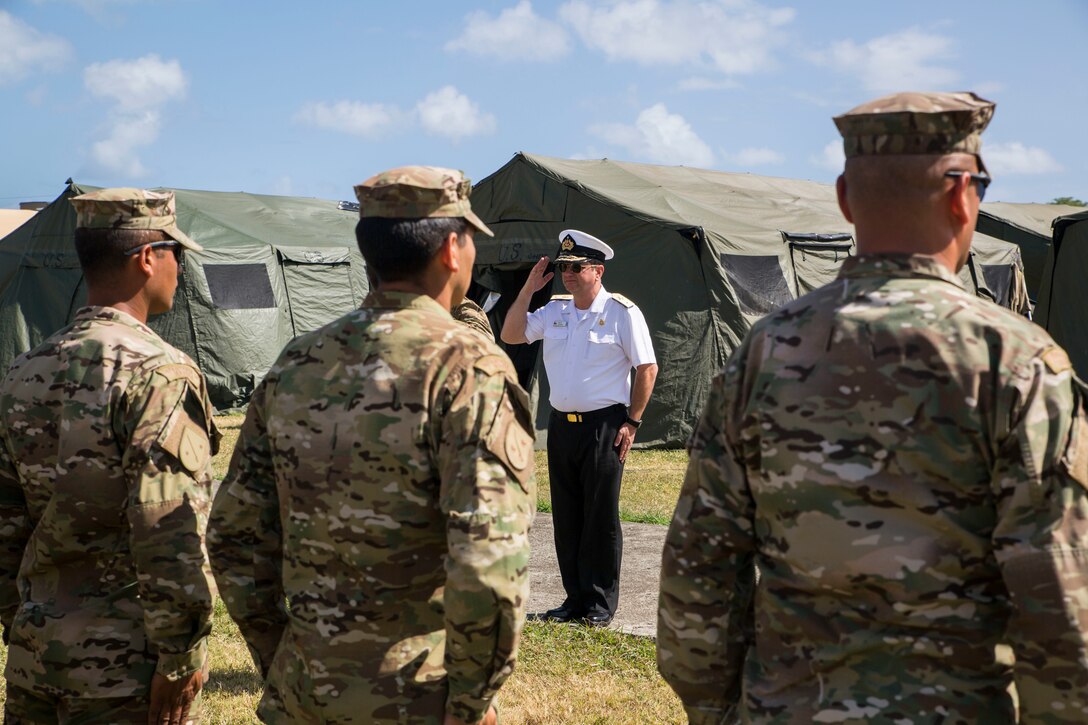 Chilean Navy Commodore Pablo Niemann, Combined Force Maritime Component Commander for Rim of the Pacific (RIMPAC) exercise, speaks with RIMPAC participants on Marine Corps Base Hawaii July 6, 2018.  Twenty-five nations, 46 ships, five submarines, about 200 aircraft and 25,000 personnel are participating in RIMPAC from June 27 to Aug. 2 in and around the Hawaiian Islands and Southern California. The world’s largest international maritime exercise, RIMPAC provides a unique training opportunity while fostering and sustaining cooperative relationships among participants critical to ensuring the safety of sea lanes and security of the world’s oceans.