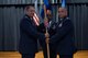 U.S. Air Force Col. Steven M. Zubowicz, 52nd Mission Support Group commander, gives the ceremonial guidon to Maj. Michael C. Murphy, incoming 52nd Communications Squadron commander, during the 52nd CS change of command ceremony at Spangdahlem Air Base, Germany, July 10, 2018. (U.S. Air Force photo by Airman 1st Class Jovante Johnson)