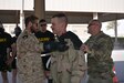 Capt. Abdul-Aziz Hamad Al-Muteri (left), with the Kuwait Minister of Defense Weapons of Mass Destruction Defense Directorate and Lt. Col. Dr. Donald Kimbler (right), deputy chief, Chemical Casualty Care Division, U.S. Army Medical Research Institute of Chemical Defense (USAMRICD) test a simulated casualty for exposure to nerve agent during a training event June 27, 2018.