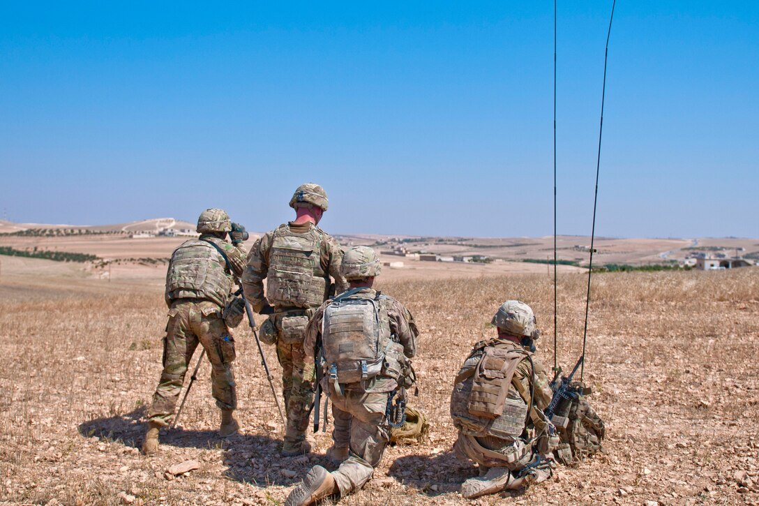 A U.S. soldier communicates with his headquarters leadership team.