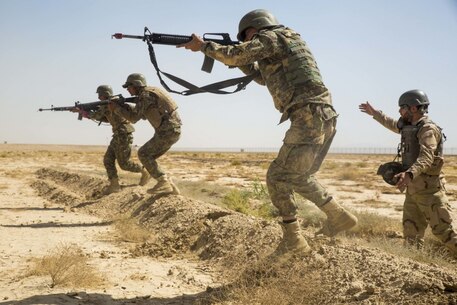 HELMAND PROVINCE, Afghanistan (June 20, 2018) - Afghan National Army (ANA) 215th Corps soldiers bound as a squad toward a notional enemy during a range at Camp Shorabak. The ANA soldiers conducted squad attacks during a training exercise as part of the Operational Readiness Cycle, which is a training segment designed to enhance ANA soldiers’ infantry skills and bolster overall unit effectiveness. (U.S. Marine Corps photo by Sgt. Luke Hoogendam)