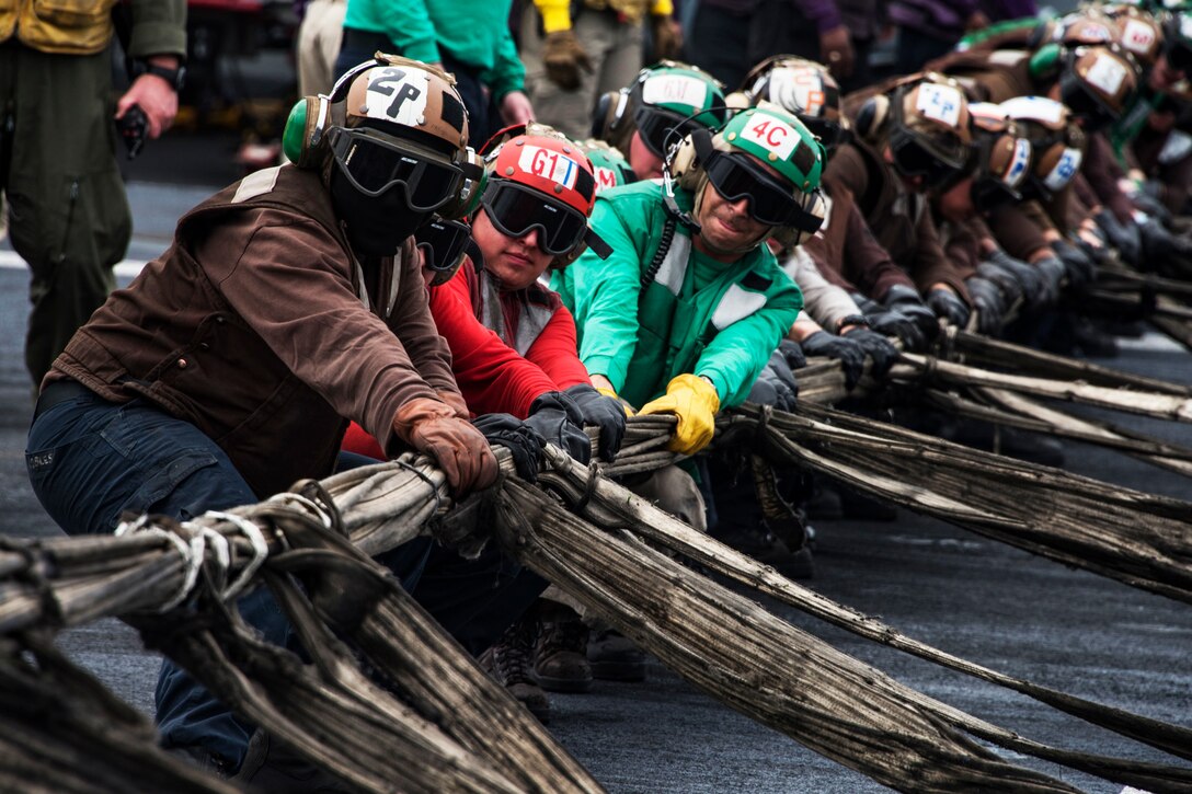 Sailors set up a barricade during a mass-casualty drill.