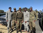 145th Airlift Wing Security Force Tech. Sgt. Adam Barringer, left, and Staff Sgt. Eric Stitt, second from right, pose for a picture with their Botswana Defense Force counterparts. North Carolina Air National Guard’s 145th Airlift Wing Security Forces travelled to Botswana, Africa, in late June 2018, to work side-by-side with their Botswana Defense Air Force (BDF).
