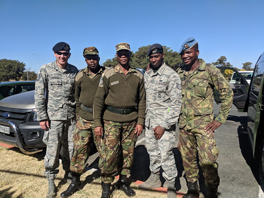 145th Airlift Wing Security Force Tech. Sgt. Adam Barringer, left, and Staff Sgt. Eric Stitt, second from right, pose for a picture with their Botswana Defense Force counterparts. North Carolina Air National Guard’s 145th Airlift Wing Security Forces travelled to Botswana, Africa, in late June 2018, to work side-by-side with their Botswana Defense Air Force (BDF).