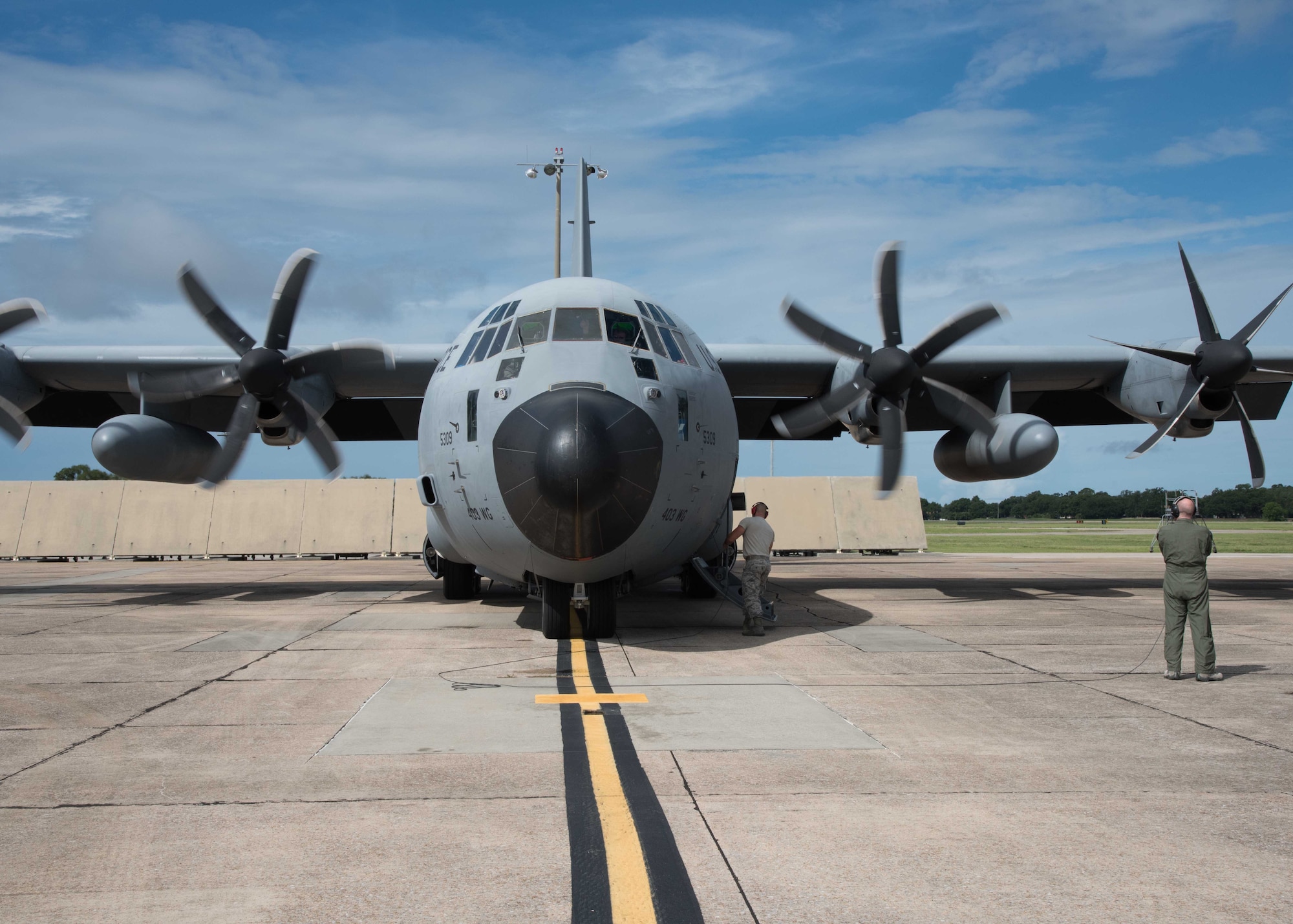 Tech. Sgt. Zachary Zieman, 53rd Weather Reconnaissance Squadron loadmaster and dropsonde operator, assists the aircrew with the engine startup prior to takeoff for a mission into Tropical Storm Chris July 8, 2018, to gather weather data for the National Hurricane Center for use in their forecasts. (U.S. Air Force photo/Maj. Marnee A.C. Losurdo)