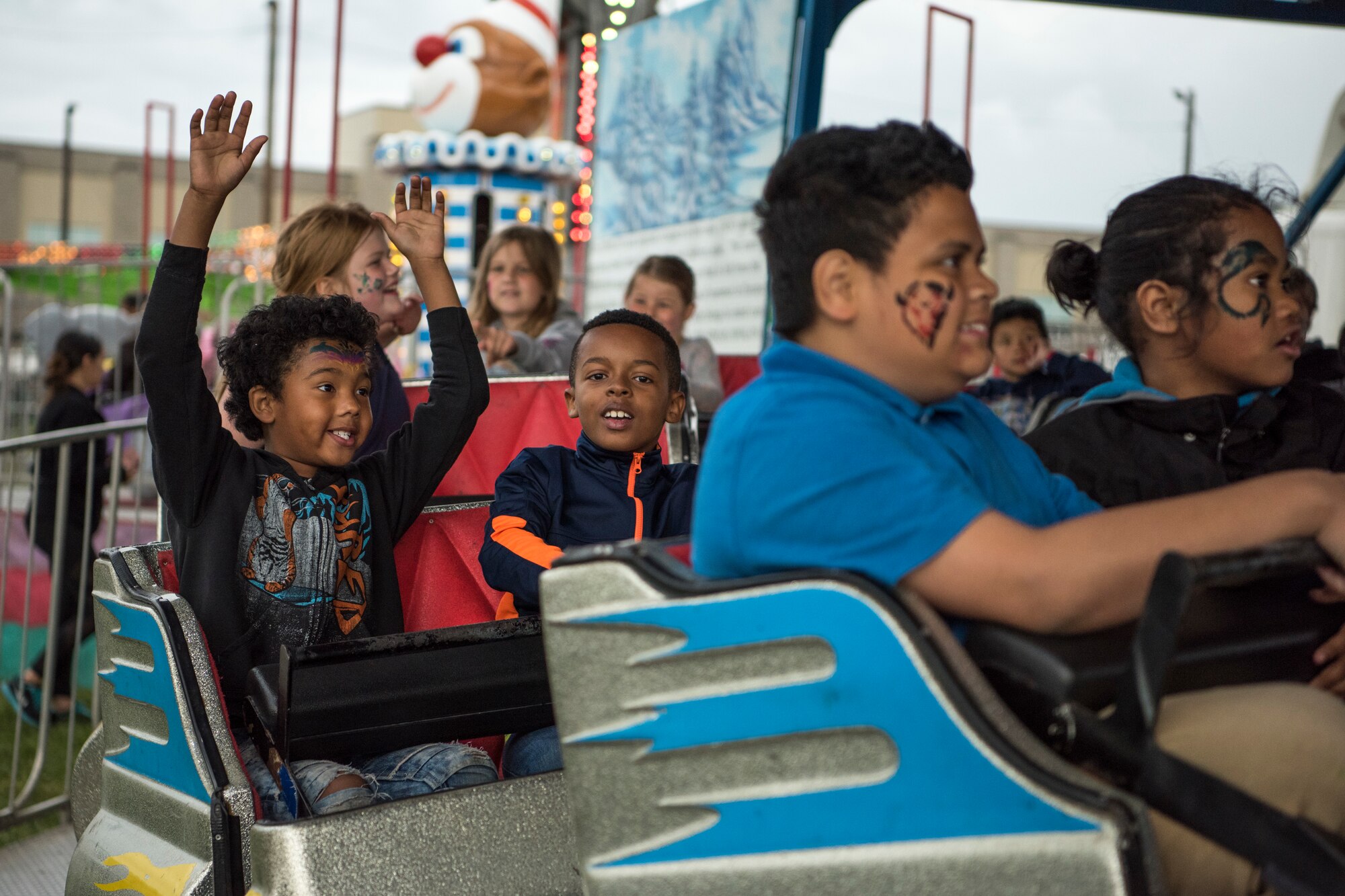 Children ride the “Silver Streak” during the 3rd annual Summer Fest hosted by the 673d Force Support Squadron at Joint Base Elmendorf-Richardson, Alaska, July 8, 2018. The event was open to anyone with base access and offered free activities such as carnival rides, a petting zoo, face painting, a bungee trampoline, and carnival games.