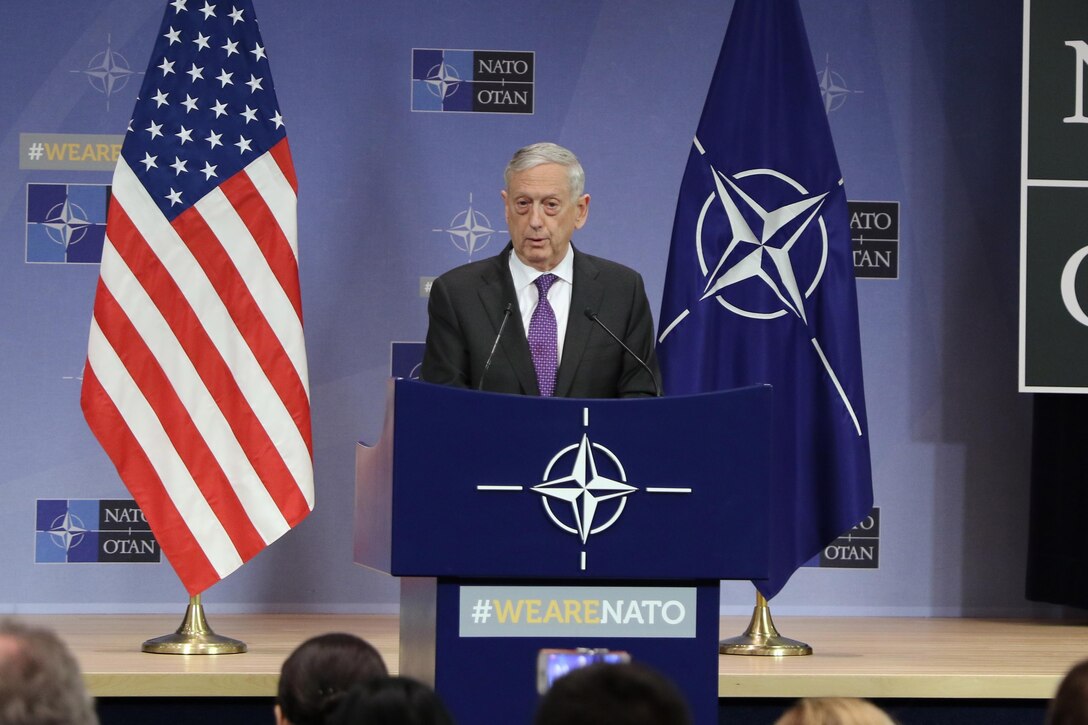 Defense Secretary James N. Mattis briefs reporters during a news conference in Brussels.
