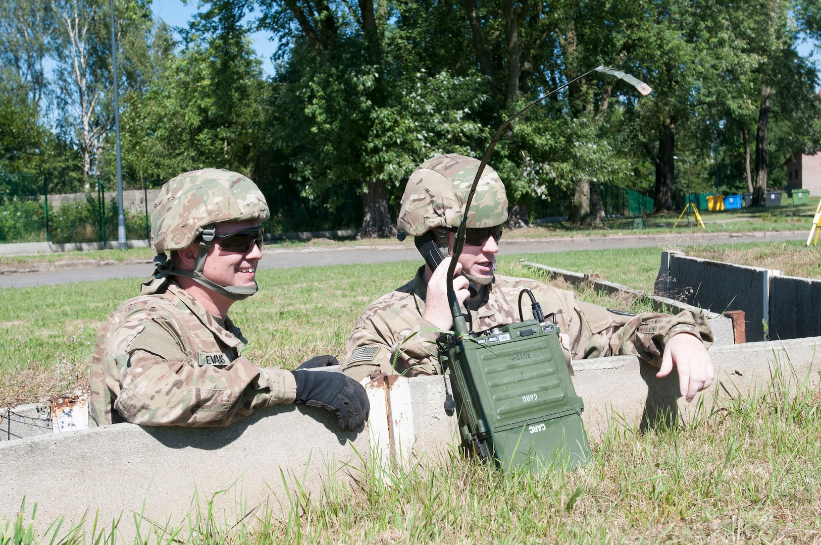 U.S. Army Spc. Jeffery Evans and Pfc. John Collins, both assigned to Company B, 151st Expeditionary Signal Battalion, confirm message transmission on a high frequency radio via a field-expedient antenna created from internet cable and plastic spoons during an HF radio class taught by Staff Sgt. David Nelson, a signal support systems specialist assigned to 218th MEB in support of Resolute Castle 2018.