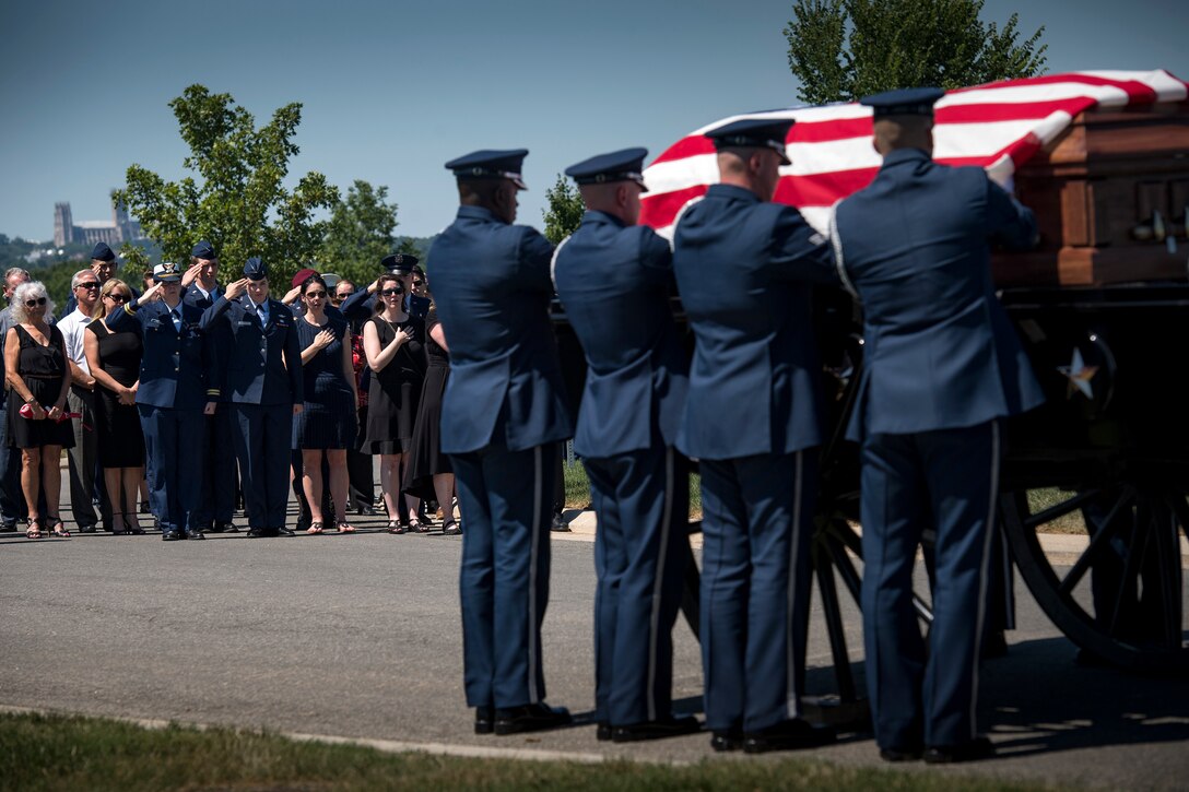Friends and family of Capt. Mark Weber watch as his casket is transferred to a horse-led caisson during his funeral service, July 9, 2018, at Arlington National Cemetery, Va. Weber, a 38th Rescue Squadron combat rescue officer and Texas native, was killed in an HH-60G Pave Hawk crash in Anbar Province, Iraq, March 15. Friends, family, and Guardian Angel Airmen traveled from across the U.S. to attend the ceremony and pay their final respects. (U.S. Air Force photo by Staff Sgt. Ryan Callaghan)