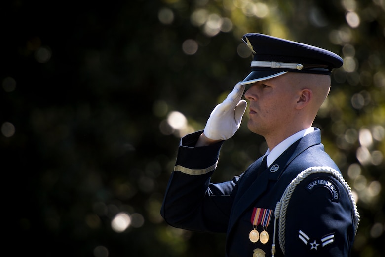 A U.S. Air Force Honor Guard ceremonial guardsman salutes Capt. Mark Weber’s casket during his funeral service, July 9, 2018, at Arlington National Cemetery, Va. Weber, a 38th Rescue Squadron combat rescue officer and Texas native, was killed in an HH-60G Pave Hawk crash in Anbar Province, Iraq, March 15. Friends, family, and Guardian Angel Airmen traveled from across the U.S. to attend the ceremony and pay their final respects. (U.S. Air Force photo by Staff Sgt. Ryan Callaghan)