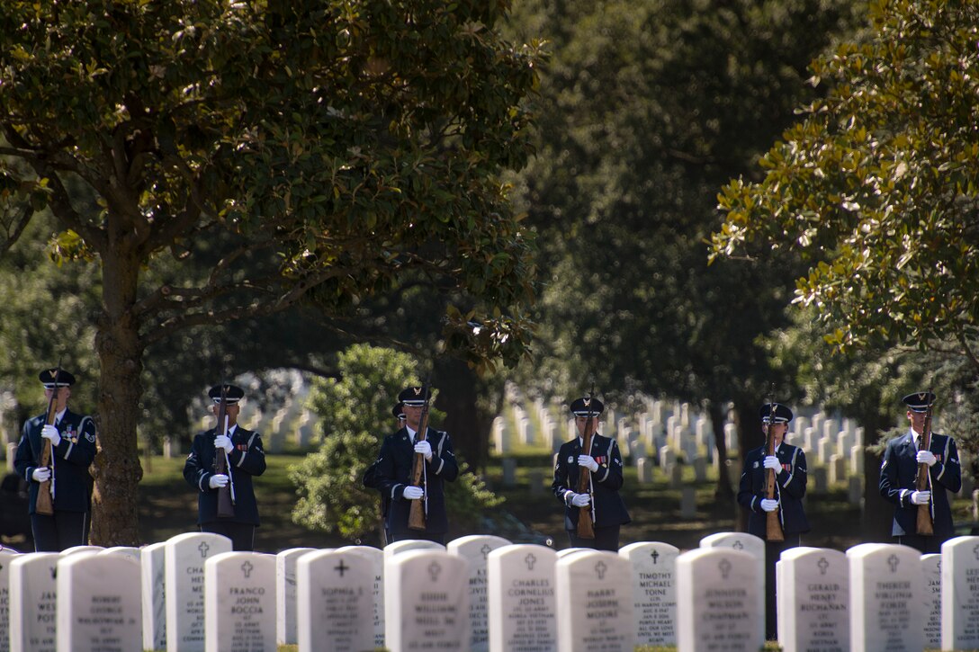 A firing-party from the U.S. Air Force Honor Guard stand ready during a funeral service for Capt. Mark Weber, July 9, 2018, at Arlington National Cemetery, Va. Weber, a 38th Rescue Squadron combat rescue officer and Texas native, was killed in an HH-60G Pave Hawk crash in Anbar Province, Iraq, March 15. Friends, family, and Guardian Angel Airmen traveled from across the U.S. to attend the ceremony and pay their final respects. (U.S. Air Force photo by Staff Sgt. Ryan Callaghan)