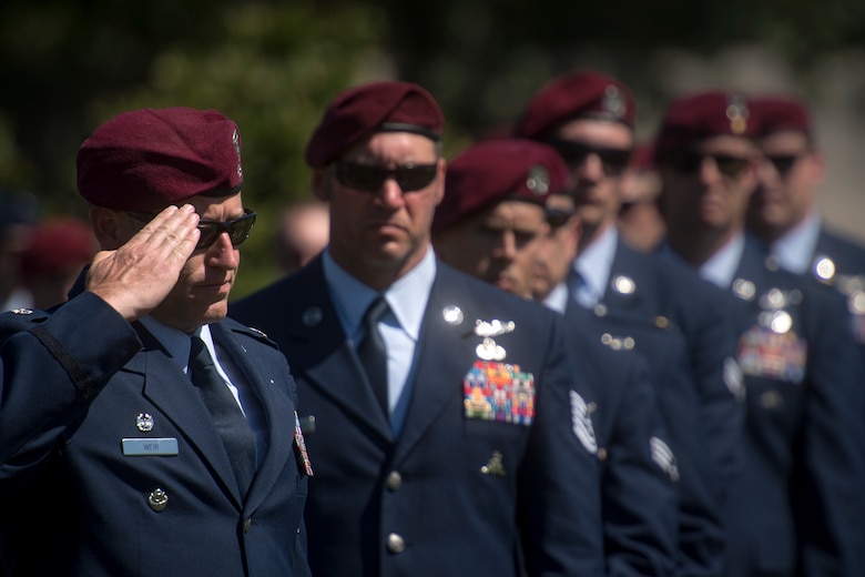 A combat rescue officer from the 103d Rescue Squadron salutes Capt. Mark Weber’s casket during his funeral service, July 9, 2018, at Arlington National Cemetery, Va. Weber, a 38th Rescue Squadron combat rescue officer and Texas native, was killed in an HH-60G Pave Hawk crash in Anbar Province, Iraq, March 15. Friends, family, and Guardian Angel Airmen traveled from across the U.S. to attend the ceremony and pay their final respects. (U.S. Air Force photo by Staff Sgt. Ryan Callaghan)