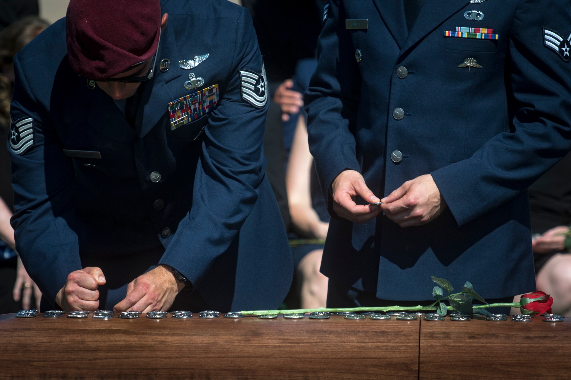 Pararescuemen pound their beret flashes into Capt. Mark Weber’s casket during his funeral service, July 9, 2018, at Arlington National Cemetery, Va. Weber, a 38th Rescue Squadron combat rescue officer and Texas native, was killed in an HH-60G Pave Hawk crash in Anbar Province, Iraq, March 15. Friends, family, and Guardian Angel Airmen traveled from across the U.S. to attend the ceremony and pay their final respects. (U.S. Air Force photo by Staff Sgt. Ryan Callaghan)