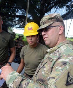 Combined Joint Task Force Hope commander Col. Israel Romero (right), chats with 1st Lt. Yamilet Estefani Alabi, a Salvadoran soldier, who is in charge of U.S. Soldiers and Marines at a school construction site in El Amate. The Americans are in here in La Paz District as part of U.S. Army South-led Beyond the Horizon exercise lasting May 12 through Aug. 4, 2018.