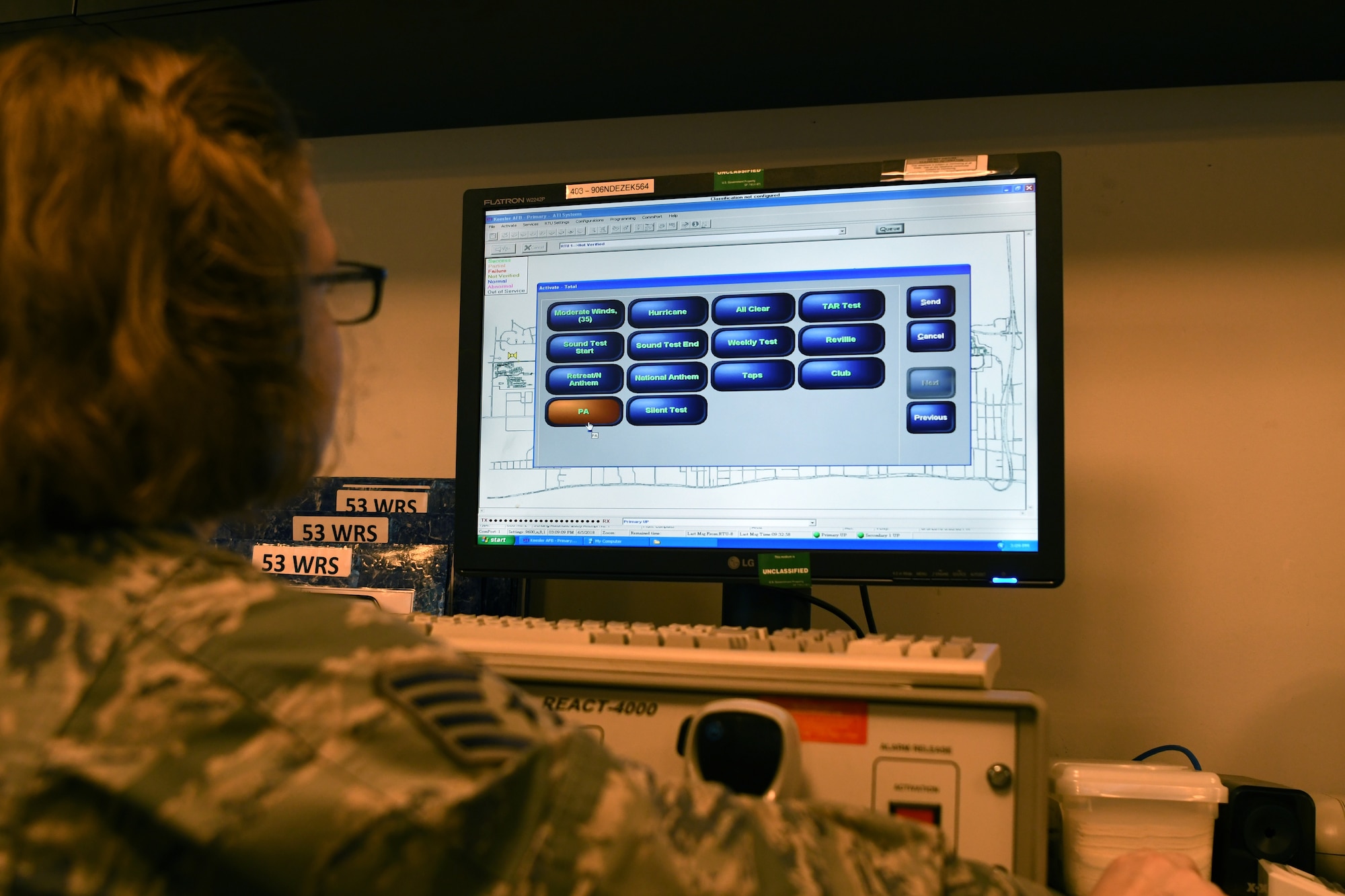 U.S. Air Force Staff Sgt. Kaylee Sprout, 81st Training Wing emergency action controller NCO in charge of systems, looks over the giant voice, an emergency notification system, in the command post at Keesler Air Force Base, Mississippi, June 5, 2018. Emergency action controllers are responsible for receiving and disseminating information during emergencies. (U.S. Air Force photo by Airman 1st Class Suzie Plotnikov)