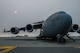 Matt Stevens, left, a U.S. Department of Agriculture airport biologist, and U.S. Air Force Capt. Sean Harte, 60th Air Mobility Wing Safety Office flight commander, go over C-17 Globemaster III pre-flight procedures before a safety familiarization flight at Travis Air Force Base, Calif., July 2, 2018. The flight allowed Stevens, who helps manage the Bird/Wildlife Aircraft Strike Program at Travis to get a firsthand view of what pilots see during training flights near the base. (U.S. Air Force photo by Master Sgt. Joey Swafford)