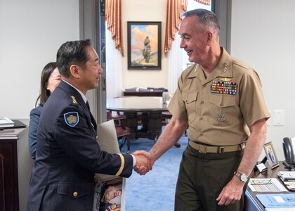 Chairman of the Joint Chiefs of Staff Gen. Joe Dunford greets Chief of Staff, Japan Ground Self-Defense Force, Gen. Koji Yamazaki during an office visit in the Pentagon, July 10, 2018.