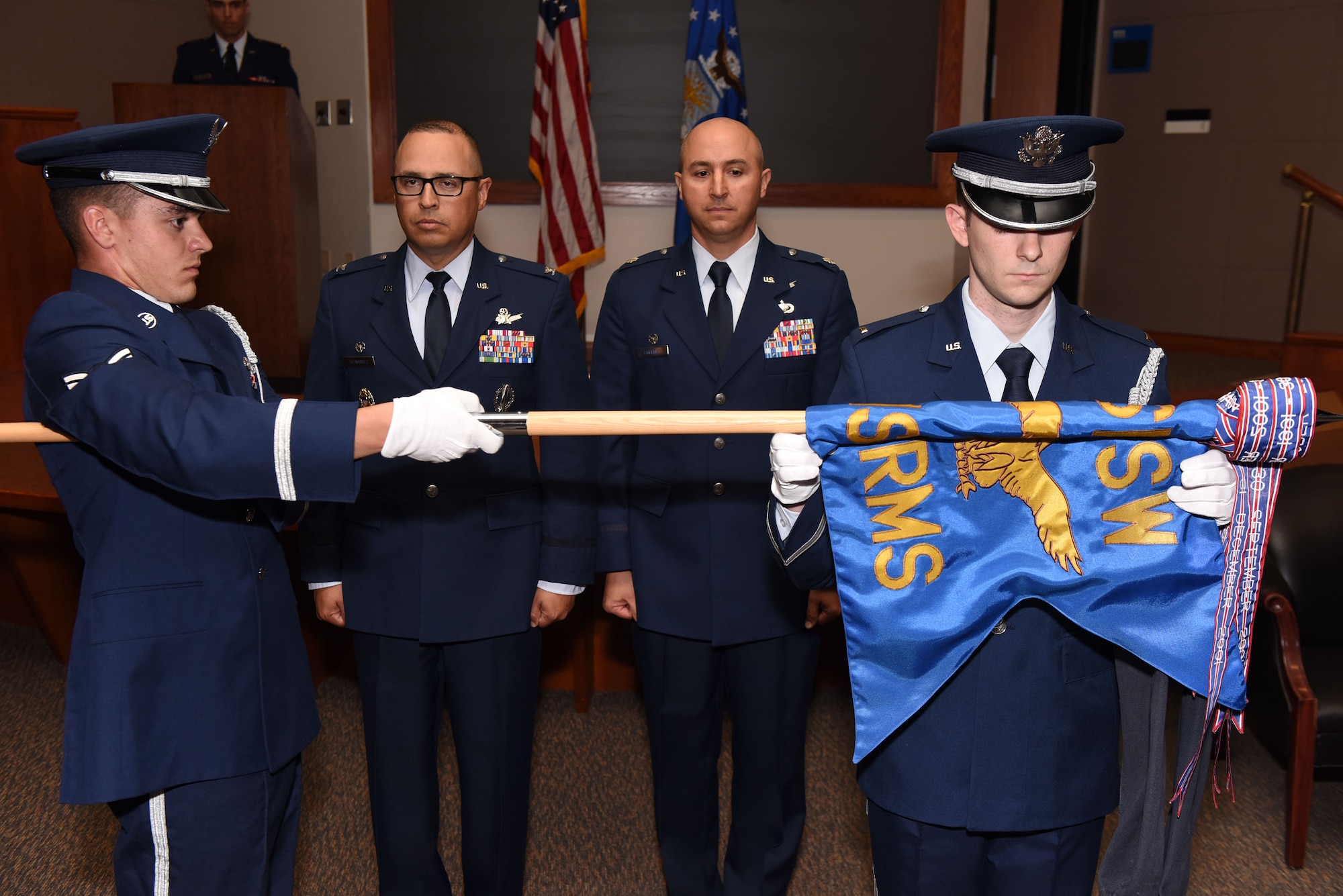 Col. Curtis Hernandez, 30th Operations Group commander, and Lt. Col. Max Coberly, 30th Range Management Squadron commander, inactivate the 30th RMS and merge with the 2nd Range Operations Squadron at Vandenberg Air Force Base, Calif., on July 10, 2018. The reorganization allows all range mission assurance operations to be conducted under a single chain of command. (U.S. Air Force photo by Tech. Sgt. Jim Araos/Released)
