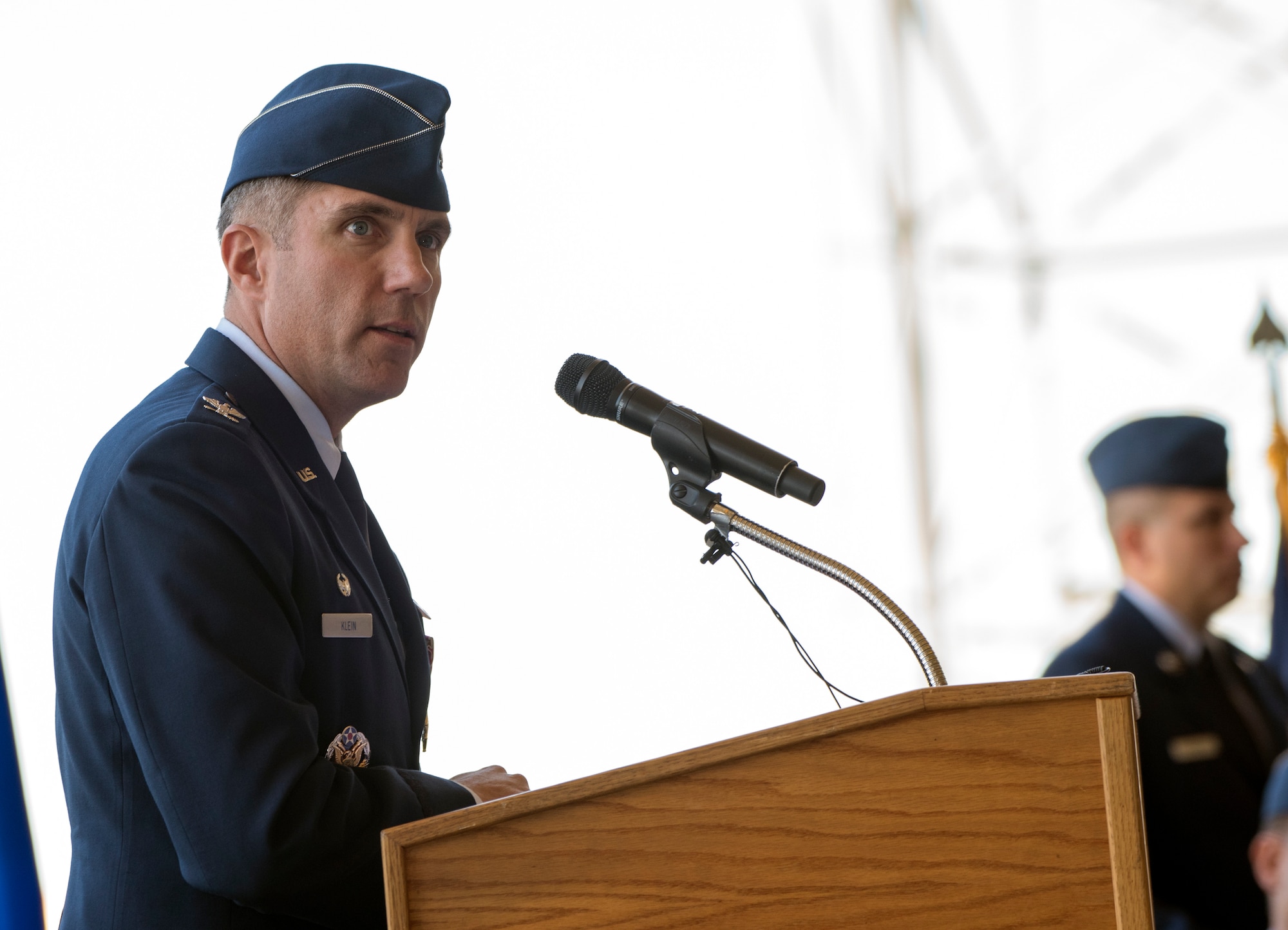 U.S. Air Force Col. John Klein delivers his final speech as commander, 60th Air Mobility Wing, during a change of command ceremony, July 10, 2018, Travis Air Force Base, Calif. Klein relinquished command of Air Mobility Command's largest wing to Col. Ethan Griffin. (U.S. Air Force Photo by Heide Couch)