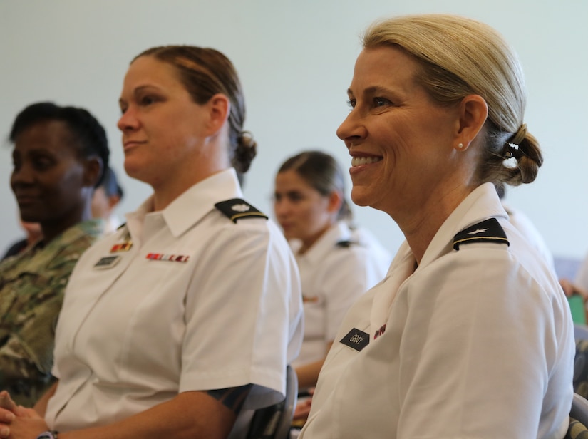 Brig. Gen. Leela Gray, USARCENT AREC Director, waits to be introduced as the guest speaker for the Sisters in Arms general session in the Yellow Ribbon room of Patton Hall. Sisters in Arms has committees for outreach, mentoring, education and treasury for Soldiers who want to be involved.