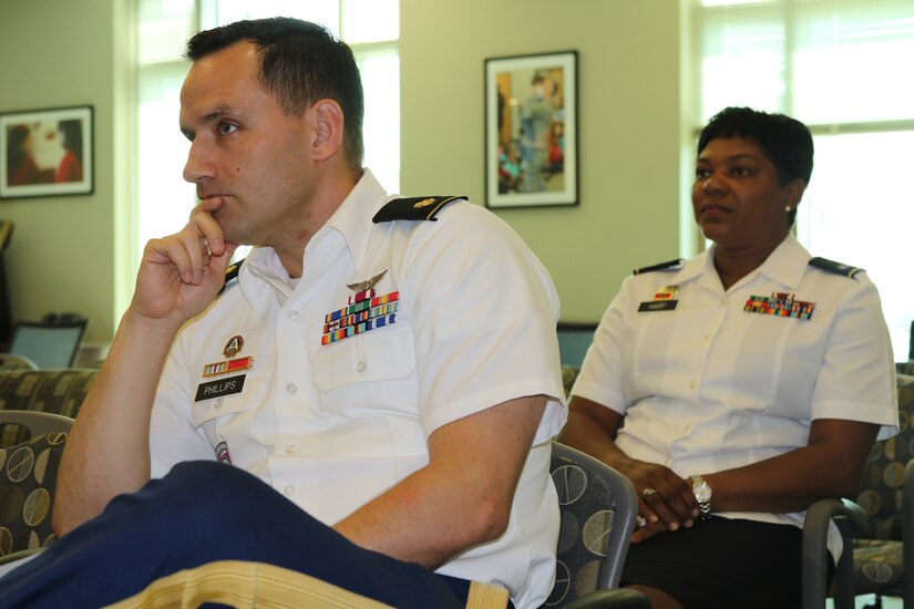 Service members from U.S. Army Central attend the Sisters in Arms general session in the Yellow Ribbon room of Patton Hall on 6 July at Shaw Air Force Base, S.C. Sisters in Arms is a professional forum that coordinates volunteer activities, advertises meetings and seminars and promotes membership.