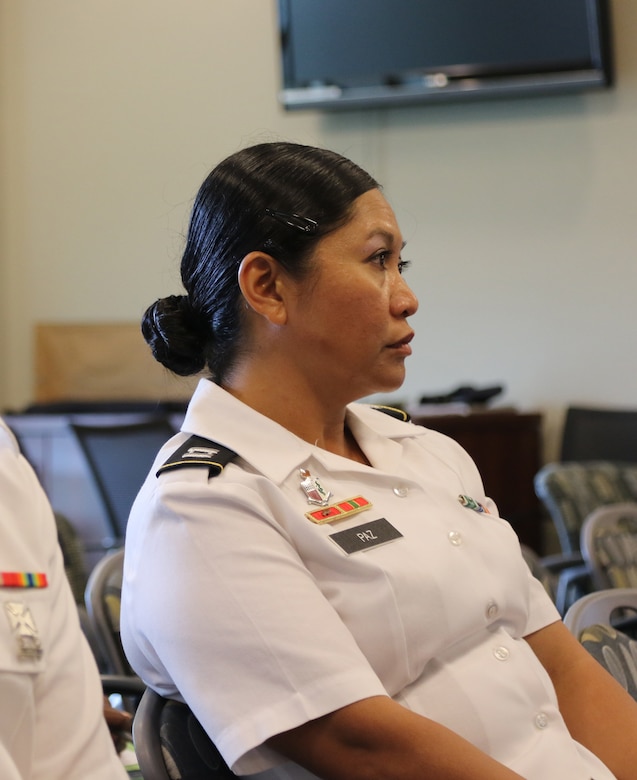 Cpt. Genelyn Paz, HHBN Physician Assistant, attends the Sisters in Arms general session in the Yellow Ribbon room of Patton Hall on 6 July at Shaw Air Force Base, S.C. Sisters in Arms has committees for outreach, mentoring, education and treasury for Soldiers who want to be involved.