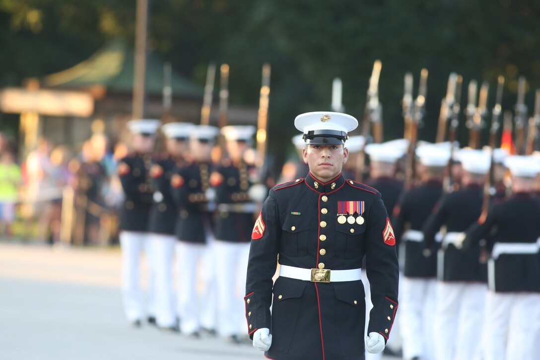 Corporal Christopher Ochoa, rifle inspector, U.S. Marine Corps Silent Drill Platoon, marches across the parade deck during a Tuesday Sunset Parade at the Lincoln Memorial, Washington D.C., July 10, 2018. The guest of honor for the parade was the former Vice President of the U.S., Joe Biden, and the hosting official was the Staff Judge Advocate to the Commandant of the Marine Corps, Maj. Gen. John R. Ewers Jr. (Official Marine Corps photo by LCpl Bourgeois/Released)