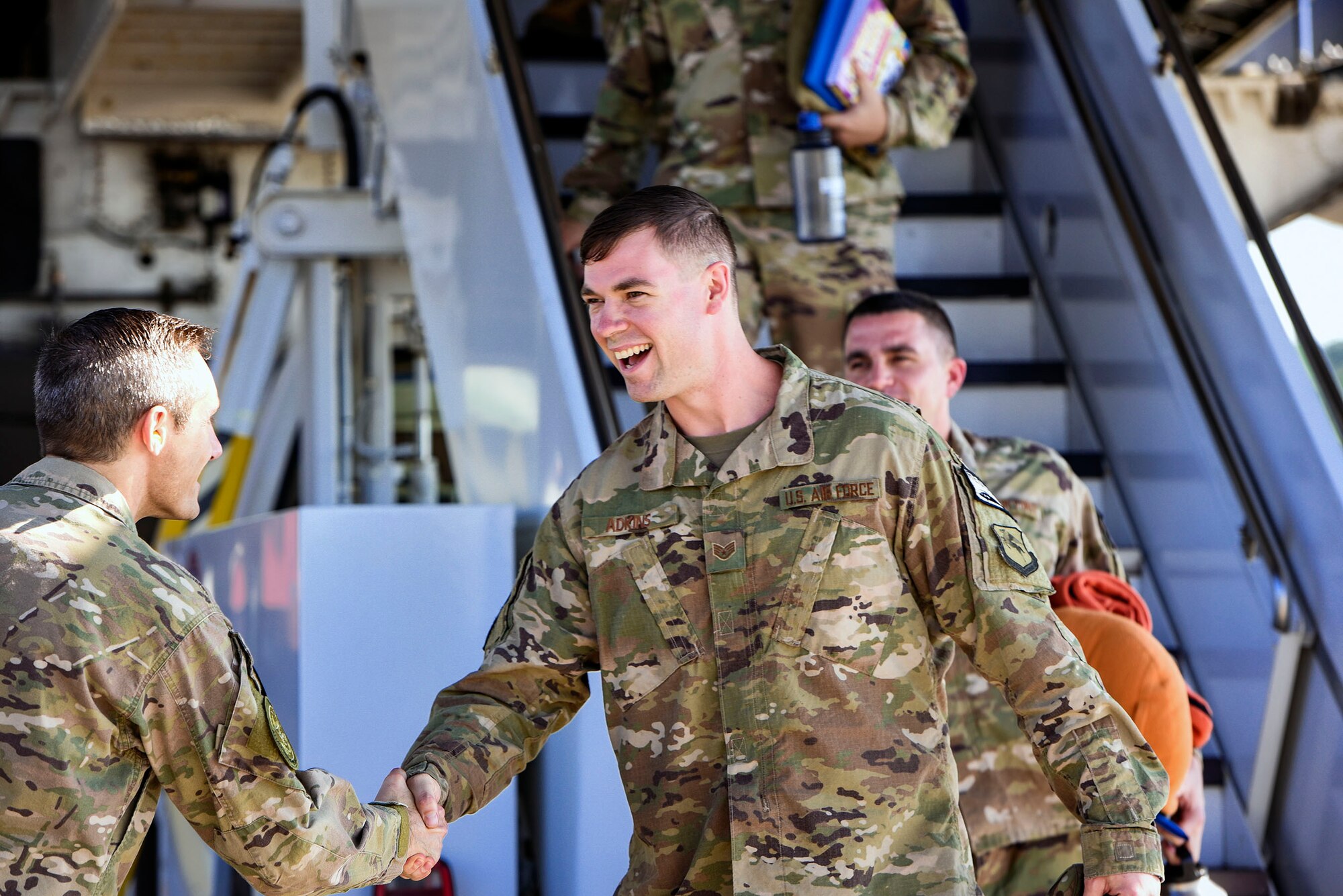 Staff Sgt. Scott Adkins, right, 723d Aircraft Maintenance Squadron aircraft armament specialist, is welcomed home by Col. Justin Demarco, 23d Wing vice commander, during the 41st Rescue Squadron’s redeployment ceremony, July 10, 2018, at Moody Air Force Base, Ga. While deployed, the 41st RQS and 41st Helicopter Maintenance Unit provided combat search and rescue capabilities and maintenance operations in support of Combined Joint Task Force-Horn of Africa. (U.S Air Force photo by Senior Airman Greg Nash)