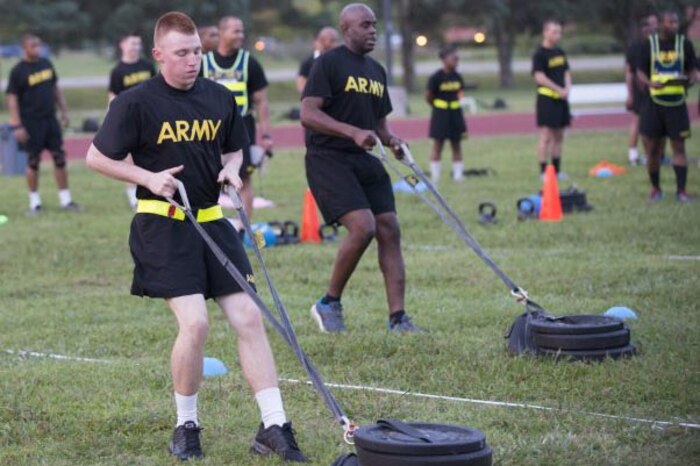 Soldiers pull sleds during an Army fitness test.