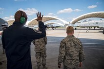 Chief Master Sgt. James Allen, 23d Wing command chief, rear, waves at an A-10C Thunderbolt II pilot during an immersion tour, July 10, 2018, at Moody Air Force Base, Ga. Allen toured the 23d Aircraft Maintenance Squadron (AMXS) to build rapport and experience the day to day operations of maintenance Airmen. Throughout his visit, Allen was able to speak with Airmen and hear their opinions and ideas behind the continued success of the AMXS. (U.S. Air Force photo by Airman 1st Class Eugene Oliver)