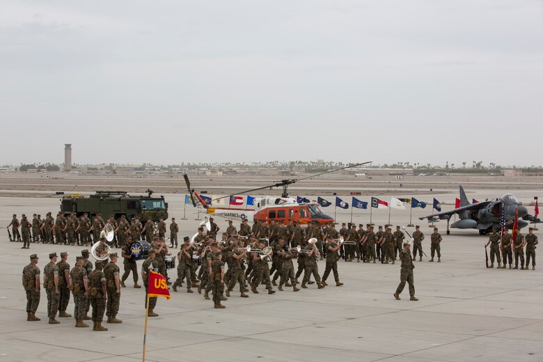 U.S. Marines with Headquarters and Headquarters Squadron (H&HS), Marine Corps Air Station (MCAS) Yuma, participate in the Change of Command Ceremony where Lt. Col. James S. Tanis, commanding officer for H&HS relinquished command to Lt. Col. James C. Paxton on MCAS Yuma, Ariz., June 15, 2018. The Change of Command Ceremony represents the transfer of responsibility, authority, and accountability from the outgoing commanding officer to the incoming commanding officer. (U.S. Marine Corps photo by Sgt. Allison Lotz)