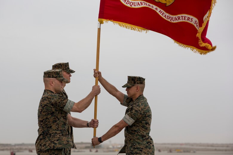 U.S. Marines with Headquarters and Headquarters Squadron (H&HS), Marine Corps Air Station (MCAS) Yuma, participate in the Change of Command Ceremony where Lt. Col. James S. Tanis, commanding officer for H&HS relinquished command to Lt. Col. James C. Paxton on MCAS Yuma, Ariz., June 15, 2018. The Change of Command Ceremony represents the transfer of responsibility, authority, and accountability from the outgoing commanding officer to the incoming commanding officer. (U.S. Marine Corps photo by Sgt. Allison Lotz)