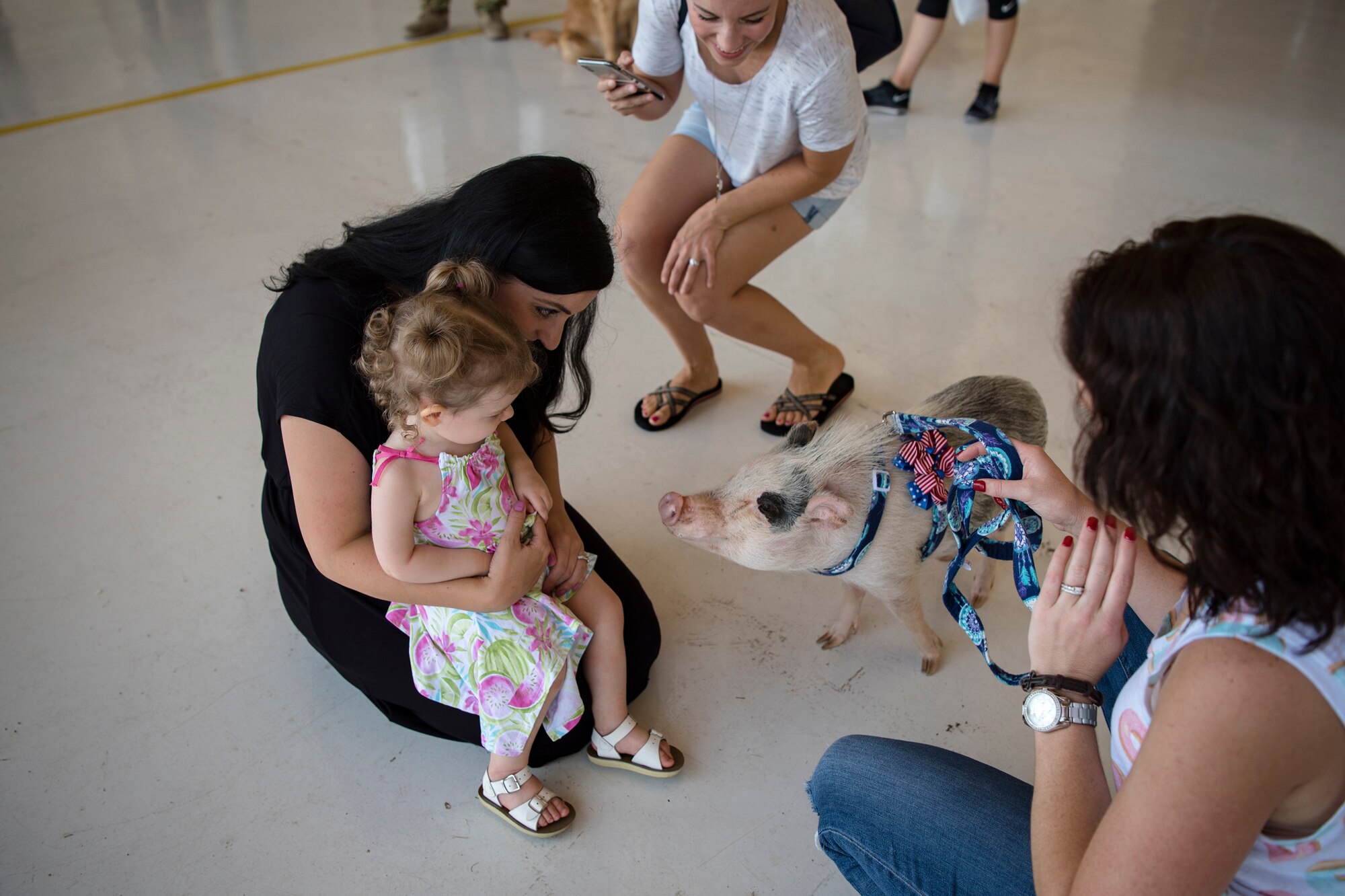Family and friends socialize during the 41st Rescue Squadron’s (RQS) redeployment ceremony, July 10, 2018, at Moody Air Force Base, Ga. While deployed, the 41st RQS and the 41st Helicopter Maintenance Unit provided combat search and rescue capabilities and maintenance operations in support of Combined Joint Task Force-Horn of Africa. (U.S. Air Force photo by Airman Taryn Butler)
