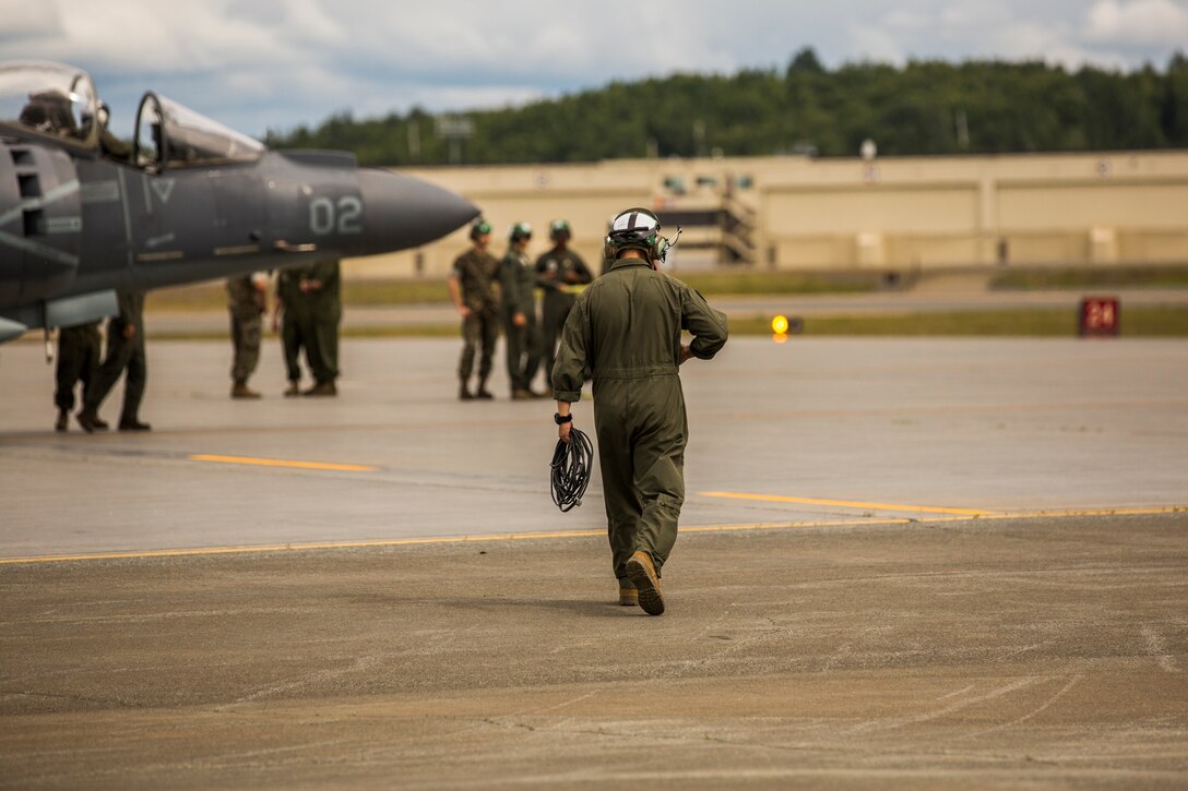 Marine Attack Squadron (VMA) 214 Marines participate in the 2018 Arctic Thunder Air Show at Joint Base Elmendorf-Richardson, Alaska, June 29, 2018. VMA-214 conducted a flyby and hover demonstration with the AV-8B Harrier during the air show. (U.S. Marine Corps photo by Lance Cpl. Sabrina Candiaflores)