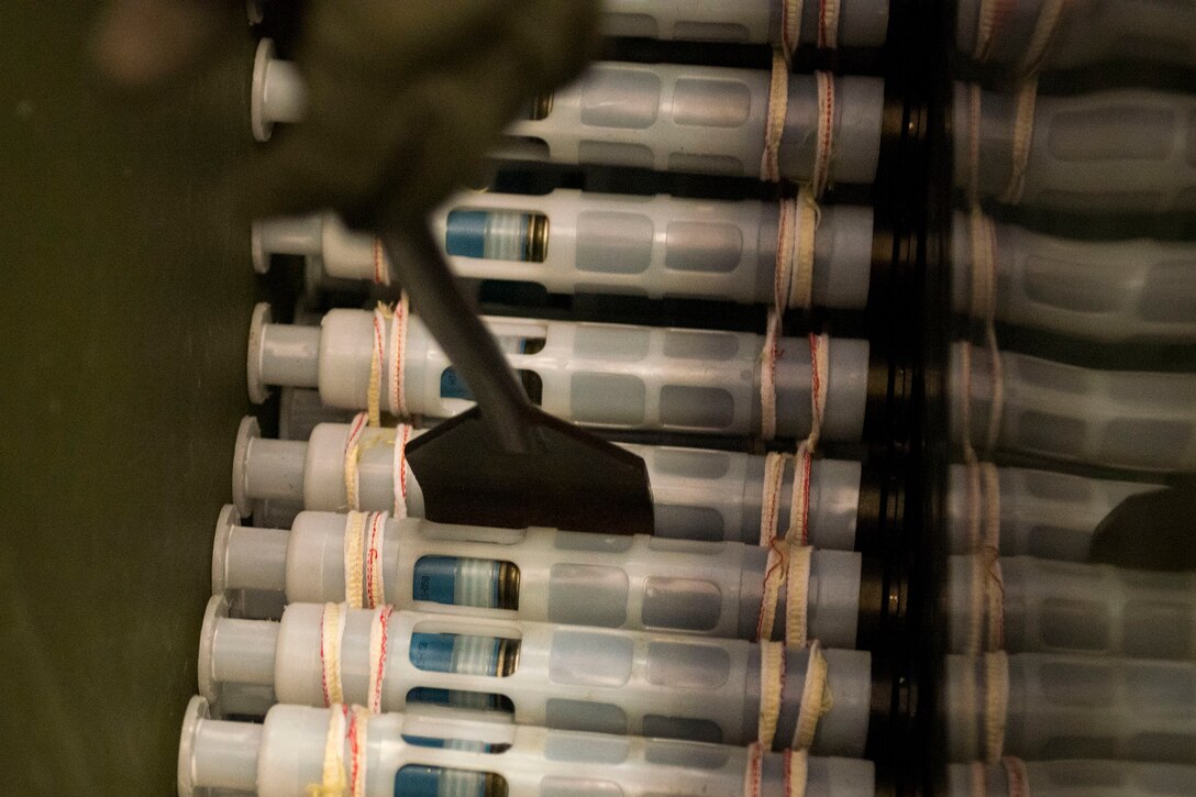 Tech. Sgt. Robert Lewis, 476th Maintenance Squadron (MXS) NCO in charge of line delivery, levels out incoming munitions during a 30mm rounds processing, July 11, 2018, at Moody Air Force Base, Ga. This total force integration training with the 23d and 476th MXS allowed Airmen to work together to identify more ways to efficiently and safely conduct their mission. The munitions flight ensures the A-10C Thunderbolt IIs are armed with 30mm rounds to make sure they are able to continue their mission while at home station and deployed. (U.S. Air Force photo by Airman 1st Class Erick Requadt)