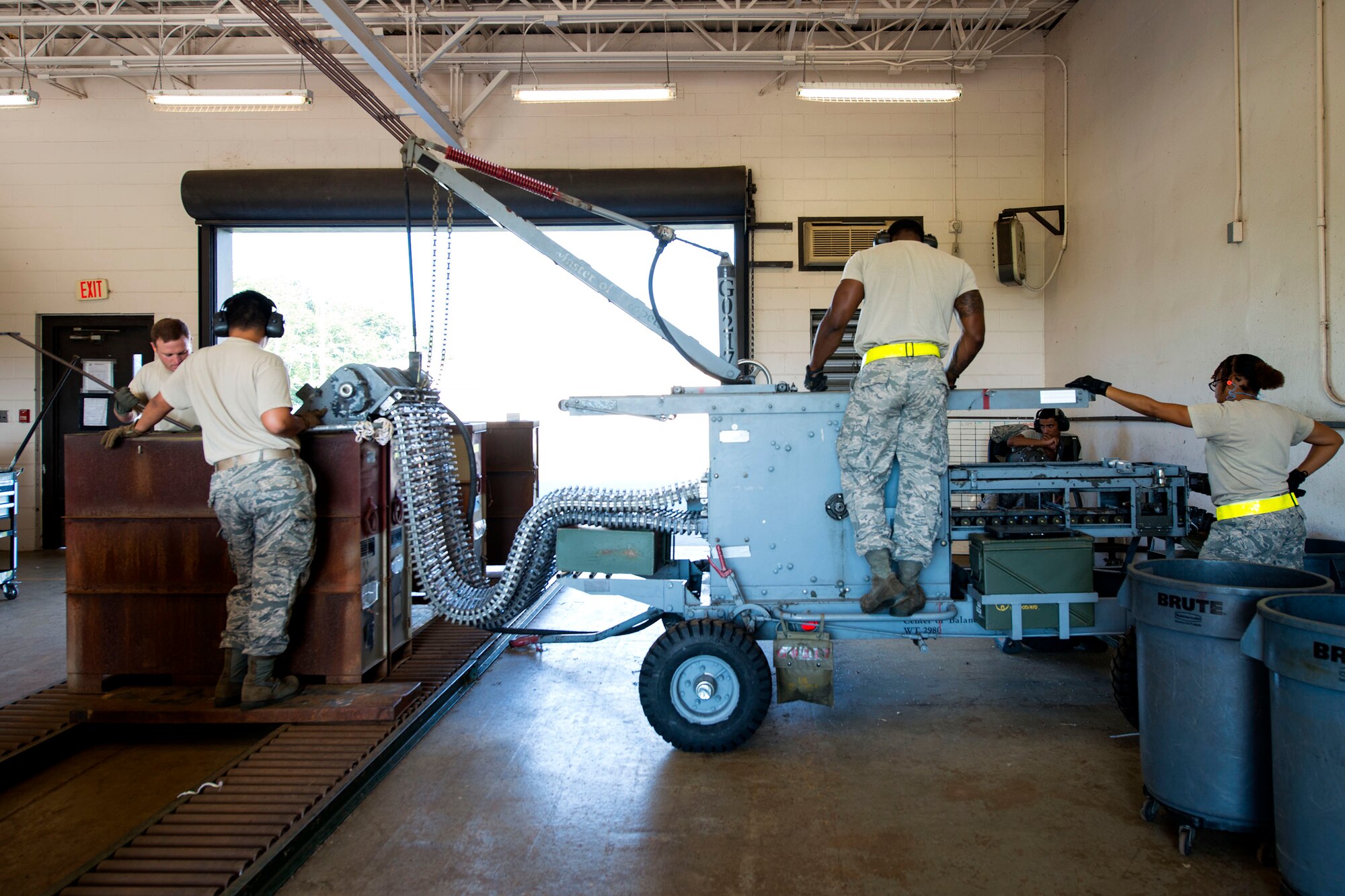 Airmen from the 476th and 23d Maintenance Squadron (MXS) work together during a 30mm rounds processing, July 11, 2018, at Moody Air Force Base, Ga. This total force integration training with the 23d and 476th MXS allowed Airmen to work together to identify more ways to efficiently and safely conduct their mission. The munitions flight ensures the A-10C Thunderbolt IIs are armed with 30mm rounds to make sure they are able to continue their mission while at home station and deployed. (U.S. Air Force photo by Airman 1st Class Erick Requadt)