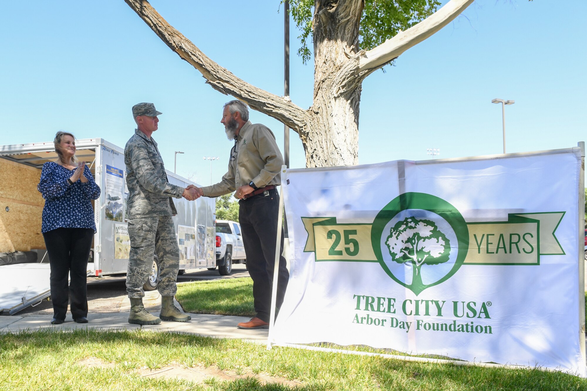 Col. Jon Eberlan, Commander, 75th Air Base Wing, shakes hands with Scott Zeidler, Wasatch Area Forester with the Utah Division of Forestry, Fire, and Statelands, upon the proclamation of Hill Air Force Base being named Tree City USA for the 25th year. (U.S. Air Force photo by Cynthia Griggs)