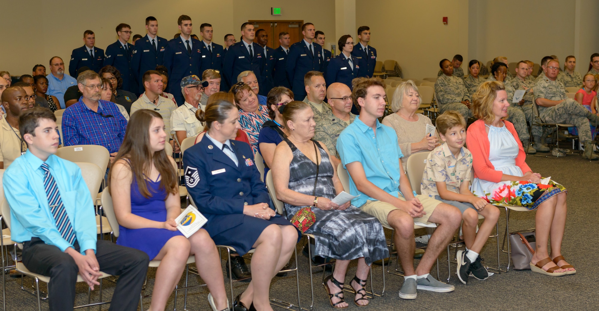Keesler personnel, families and friends attend the 81st Communications Squadron change of command ceremony in the Roberts Consolidated Aircraft Maintenance Facility Auditorium at Keesler Air Force Base, Mississippi, June 28, 2018. U.S. Air Force Maj. Jon Drummond, incoming 81st CS commander, assumes command from Lt. Col. Jerry Hambright, outgoing 81st CS commander, with the passing of the guidon. (U.S. Air Force photo by Andre’ Askew)