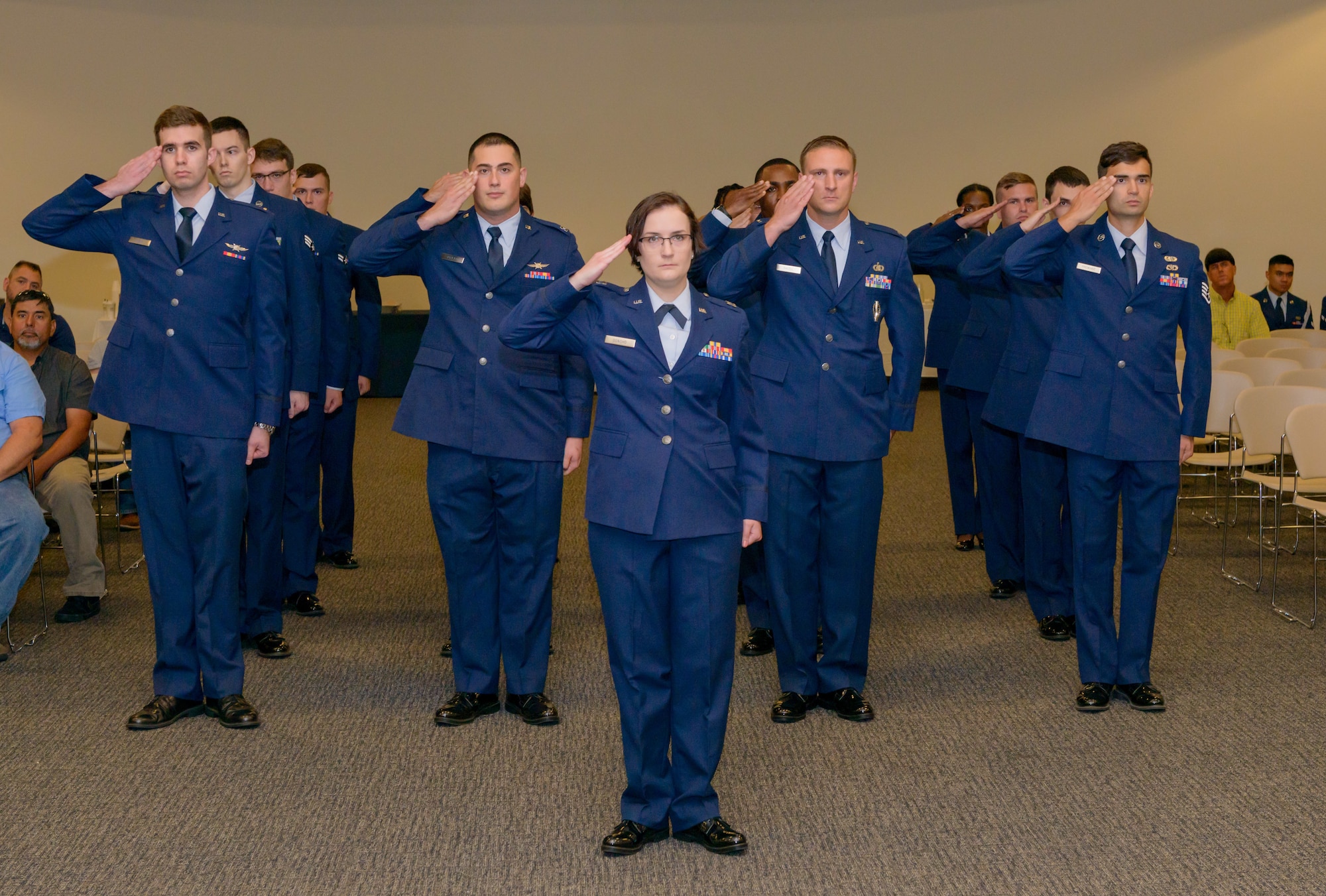 U.S. Air Force Capt. Rachel Donoho, 81st Communications Squadron flight commander, renders a salute with 81st CS personnel in formation during the 81st Communications Squadron change of command ceremony in the Roberts Consolidated Aircraft Maintenance Facility Auditorium at Keesler Air Force Base, Mississippi, June 28, 2018. 81st CS personnel gave a farewell salute to the outgoing 81st CS commander, Lt. Col. Jerry Hambright, and a welcoming salute to the new commander, Maj. Jon Drummond. (U.S. Air Force photo by Andre’ Askew)