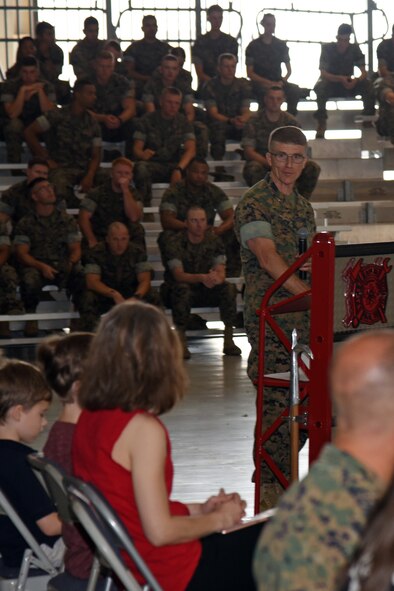U.S. Marine Corps Lt. Col. Earl Patterson, Marine Corps Detachment Goodfellow incoming commanding officer, speaks at the Marine Corps Detachment Goodfellow Change of Command at the Louis F. Garland Department of Defense Fire Academy on Goodfellow Air Force Base, Texas, July 10, 2018. During his speech, Patterson thanked his family for their support. (U.S. Air Force photo by Staff Sgt. Joshua Edwards/Released)