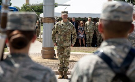 Col. Samuel E. Fiol stands at attention after receiving command of the 502nd Force Support Group in a change of command ceremony held at the JBSA-Fort Sam Houston base flagpole July 11, where he took over for outgoing commander Col. David L. Raugh.