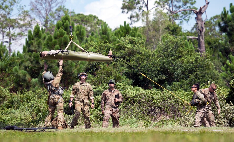 U.S. Air Force and Army medics with Joint Communication Support Element at MacDill Air Force Base, Fla. and 5-159th G-Company General Support Aviation Battalion from
Clearwater, Florida, hoist a medical manikin onto a UH-60 Black Hawk helicopter at MacDill AFB July 2, 2018.
