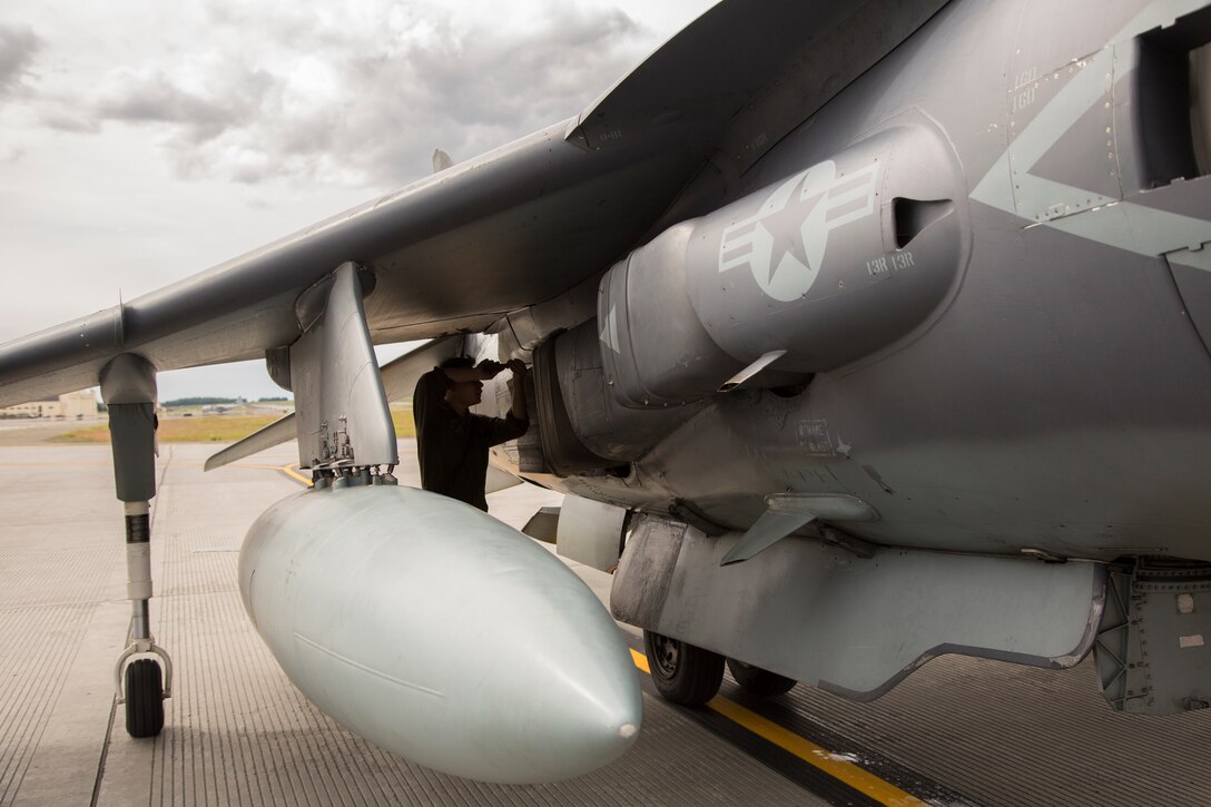 Lance Cpl. Ryan Anzai, an aircraft mechanic assigned to Marine Attack Squadron (VMA) 214 conducts his daily inspections after the arrival of their AV-8B Harriers at Joint Base Elmendorf-Richardson, Alaska, June 27, 2018. VMA-214 will participate in the 2018 Arctic Thunder Air Show with a flyby, hover demonstration and a static display. (U.S. Marine Corps photo by Lance Cpl. Sabrina Candiaflores)