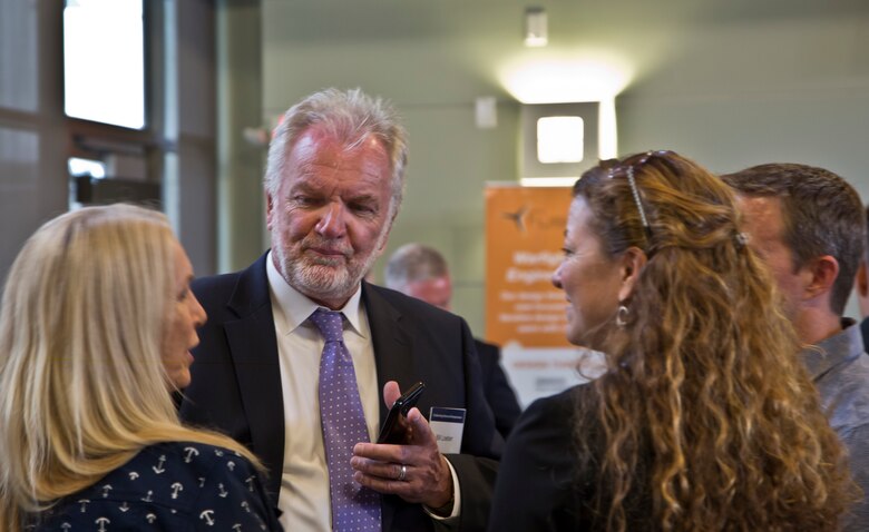 Bill Loeber, co founder of Operation Connect, a program to help transitioning military accelerate their transition into civilian careers, converses with colleagues during Startup Battlefield 101 graduation ceremony Monday, June 4, 2018, at the Ida and Cecil Green Faculty Club aboard the campus. The graduating class consisted of service members and veterans. The course was taught in partnership with SmartMoney Veterans and is designed to help transitioning service members and veterans leverage the skills they already have and translate those skills into launching businisses and creating successful civilian careers. (U.S. Marine Corps photo by Lance Cpl. Hanna Powell)