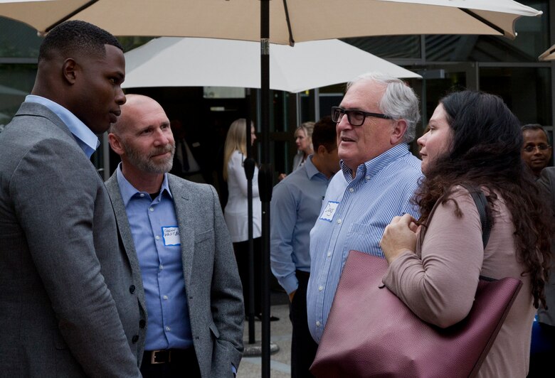 Graduates engage in a conversation after the graduation ceremony Monday, June 4, 2018,at the Ida and Cecil Green Faculty Club aboard the campus. The graduating class consisted of service members and veterans. The course was taught in partnership with SmartMoney Veterans and is designed to help transitioning service members and veterans leverage the skills they already have and translate those skills into launching businisses and creating successful civilian careers. (U.S. Marine Corps photo by Lance Cpl. Hanna Powell)