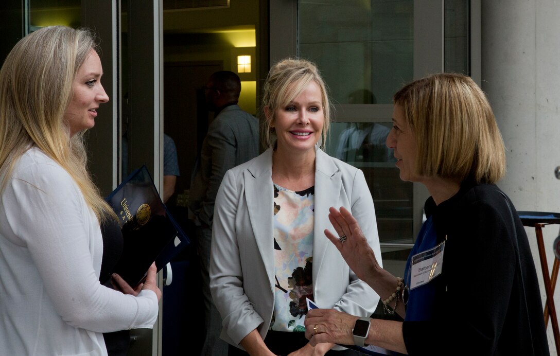 Graduates engage in a conversation after the graduation ceremony Monday, June 4, 2018, at the Ida and Cecil Green Faculty Club aboard UC San Diego. The graduating class consisted of service members and veterans. The course was taught in partnership with SmartMoney Veterans and is designed to help transitioning service members and veterans leverage the skills they already have and translate those skills into launching businisses and creating successful civilian careers. (U.S. Marine Corps photo by Lance Cpl. Hanna Powell)