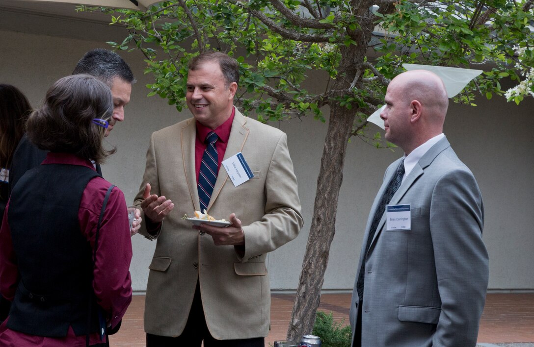 Graduates engage in a conversation after the graduation ceremony Monday, June 4, 2018, at the Ida and Cecil Green Faculty Club aboard UC San Diego. The graduating class consisted of service members and veterans. The course was taught in partnership with SmartMoney Veterans and is designed to help transitioning service members and veterans leverage the skills they already have and translate those skills into launching businisses and creating successful civilian careers. (U.S. Marine Corps photo by Lance Cpl. Hanna Powell)